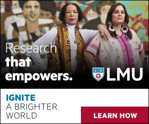 Two faculty standing in front of a mural with the words Research That Empowers and Ignite a Brighter World