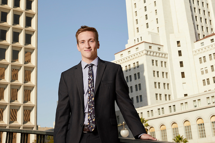 Male student in front of Los Angeles City Hall